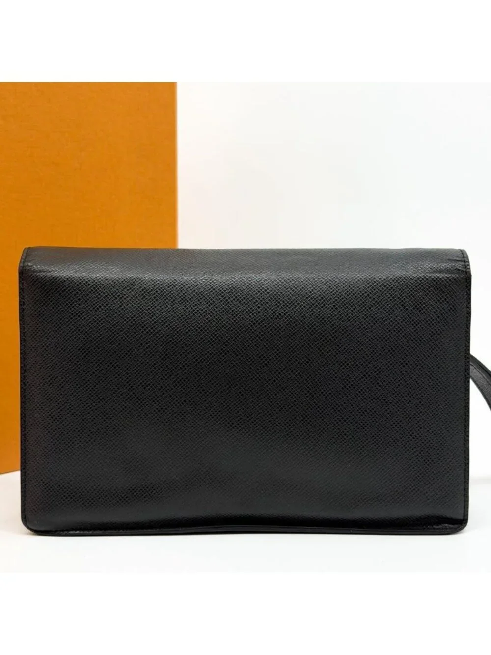 Louis Vuitton Belaia Taiga Clutch Leather